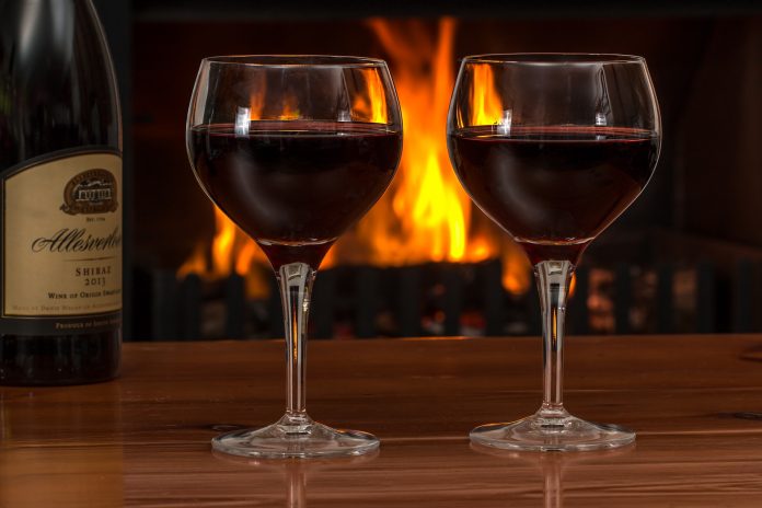 Photo of red wine and log fire for article by Dr Anne Malatt on 'What else can I do if I feel like I need a drink?'